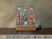 a glass block with a picture of a city on it