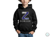 a young boy wearing a black hoodie with the letter z is for zane