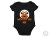 a baby bodysuit with a monster face on it